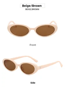 Detail view of oval beige sunglasses with brown lenses and metal hinge construction