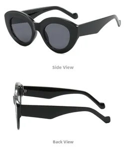 Detail view showing side and back angles of vintage black oval sunglasses with wide temples