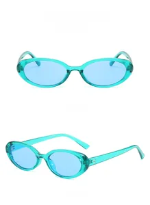Detail view of vintage oval sunglasses in transparent blue frame with metal hinges