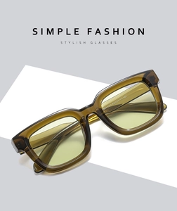 Detailed view of amber brown square sunglasses frame with stylish tinted lenses