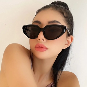 Close-up of black retro cat-eye sunglasses featuring unique triangular frame design