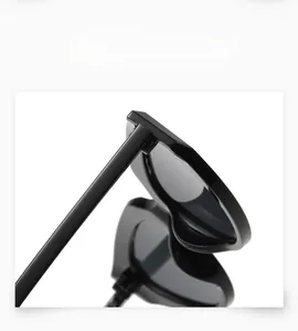 Detail of the reinforced metal hinge on black vintage cat eye sunglasses frame