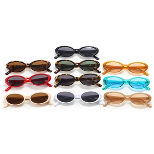 Classic oval sunglasses collection with retro 90s frames in multiple colors on white background