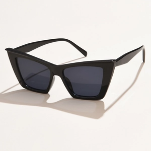 Classic black cat-eye sunglasses with thick frames and dark lenses on white background