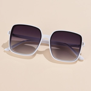 Detail view of white square sunglasses showing silver metal hinge and gradient lens