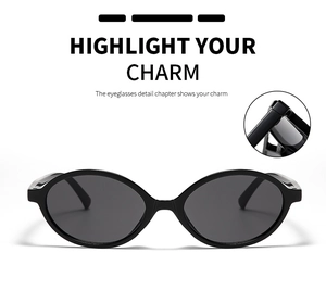 Close-up of retro oval black sunglasses featuring hinge detail and polarized lenses