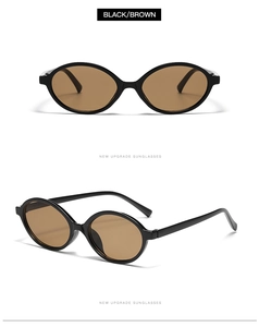 Detail view of retro small oval sunglasses with black frames and brown lenses