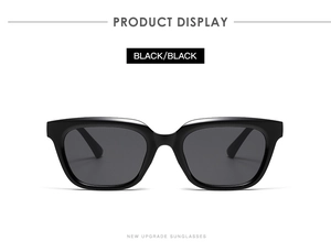 Front view of black rectangular sunglasses with glossy finish and dark lenses