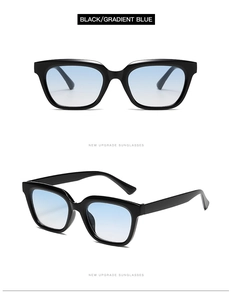 Detail view of small square sunglasses featuring black frames and gradient blue lenses