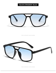 Dettagli occhiali da sole pilot oversize con montatura nera e lenti blu sfumate