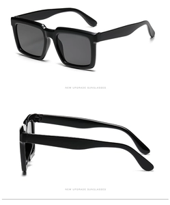Détails de la monture noire élégante et des branches courbées des lunettes de soleil carrées