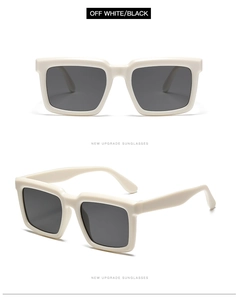 Détail de lunettes de soleil carrées blanc cassé avec verres foncés et monture épaisse