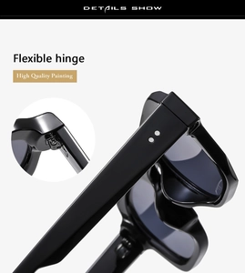 Detail view of high quality black sunglasses with flexible hinge and silver rivets