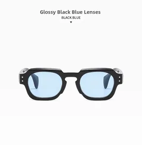 Detail of square black sunglasses frame featuring blue lenses and metal rivet accents