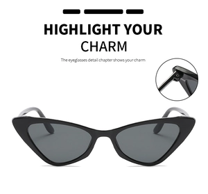 Detail view of reinforced metal hinges on vintage black cat-eye sunglasses