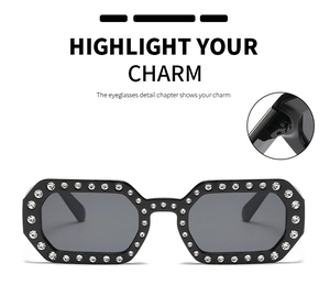 Close-up of black frames with crystal rhinestones and dark lenses for fashion sunglasses