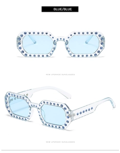 Detail view of octagon jelly sunglasses with hand-set blue rhinestones and transparent frame