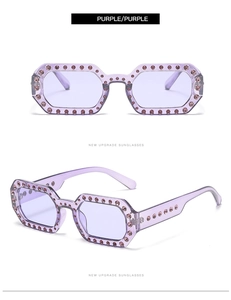 Detail view of purple hexagonal sunglasses with sparkling rhinestones and tinted lenses
