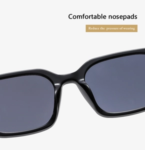 Détail des plaquettes de nez intégrées sur lunettes de soleil carrées noires pour le confort