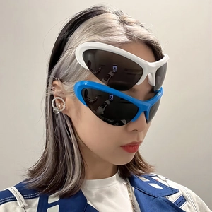 Futuristic wrap-around Y2K sunglasses in white and blue frames with sports style