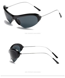 Detail of futuristic Y2K sunglasses featuring slim silver metal temples and black frame