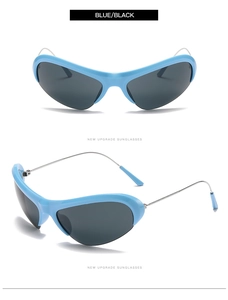 Detail of Y2K wraparound sunglasses with cyan blue frames and silver metal temples