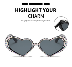 Detail shot of heart-shaped sunglasses with colorful rhinestones on the frame edges
