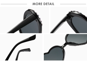 Detail view of heart-shaped sunglasses featuring colorful rhinestone embellishments