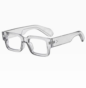 Close-up of stylish thick transparent square frames with silver metal hinges and wide temples