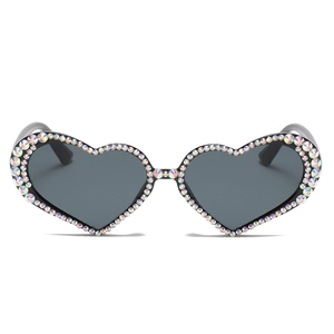 Fashionable heart shaped sunglasses with colorful rhinestones and dark lenses