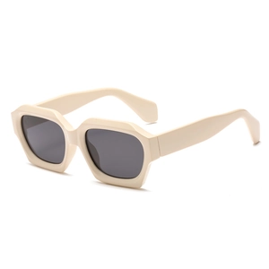Retro cream white geometric sunglasses with thick frames and dark grey pentagonal lenses