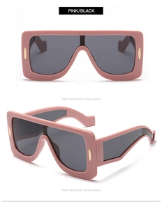 Pink oversized square sunglasses with black lenses and gold-tone metal accents