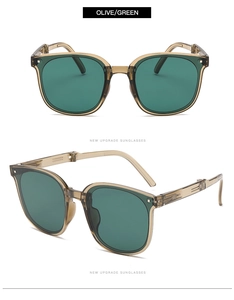 Detail view of foldable olive green sunglasses with translucent brown frames and dark lenses