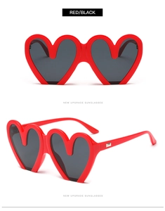 Front- und Seitenansicht der roten Herz-Sonnenbrille mit dunklen Gläsern und Glanzfinish