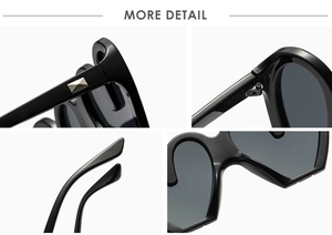 Detailsicht der schwarzen Herz-Sonnenbrille mit Metallnieten, Scharnieren und Brückendesign