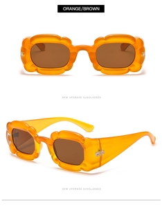 Detailansicht der gewellten orangefarbenen Blumensonnenbrille mit braunen Gläsern