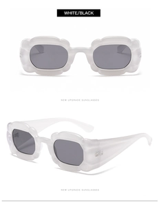 Detailansicht der unregelmäßigen Sonnenbrille in Blütenform mit weißem Rahmen und Gläsern