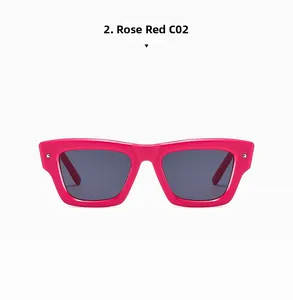 Macro shot of rose red square frame sunglasses with grey lenses and metal rivets