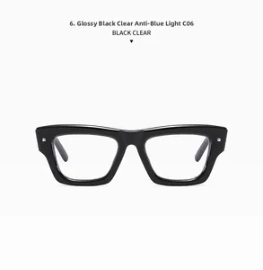 Close-up of bright black thick frames with anti-blue light clear lenses and silver rivets