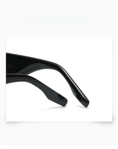 Close-up of smooth black oval sunglasses temple with polished finish and size engraving