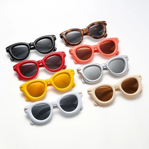 Retro cat-eye sunglasses with oval thick frames and rivet accents in eight assorted colors