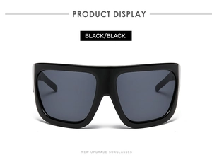 Modern flat top oversized square sunglasses with black frame and dark lenses