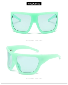 Macro view of mint green matte frame and light blue lenses of oversized sunglasses