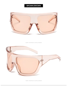Detail view of oversized brown retro sunglasses with wide temples and integrated nose pads