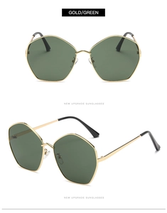 Detail of gold metal frames and green polygon lenses on stylish UV sunglasses