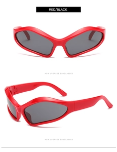 Detail view of red Y2K sports sunglasses with aerodynamic wrap frames and dark lenses