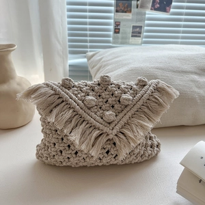 Bohemian off-white cotton macrame crossbody bag with tassel fringe and spherical textures