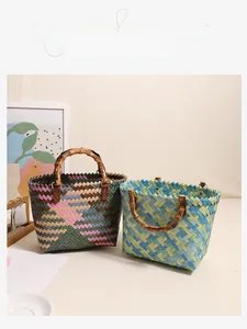 Detailed view of colorful woven straw bags with retro bamboo handles in oil painting style
