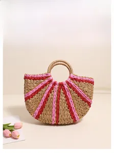 Detail of semi-circle straw tote bag showing vibrant pink stripes and golden thread texture