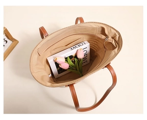 Internal view of the straw tote bag showing spacious fabric lining and pockets